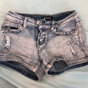 Tractor brand jean shorts with gems on them.